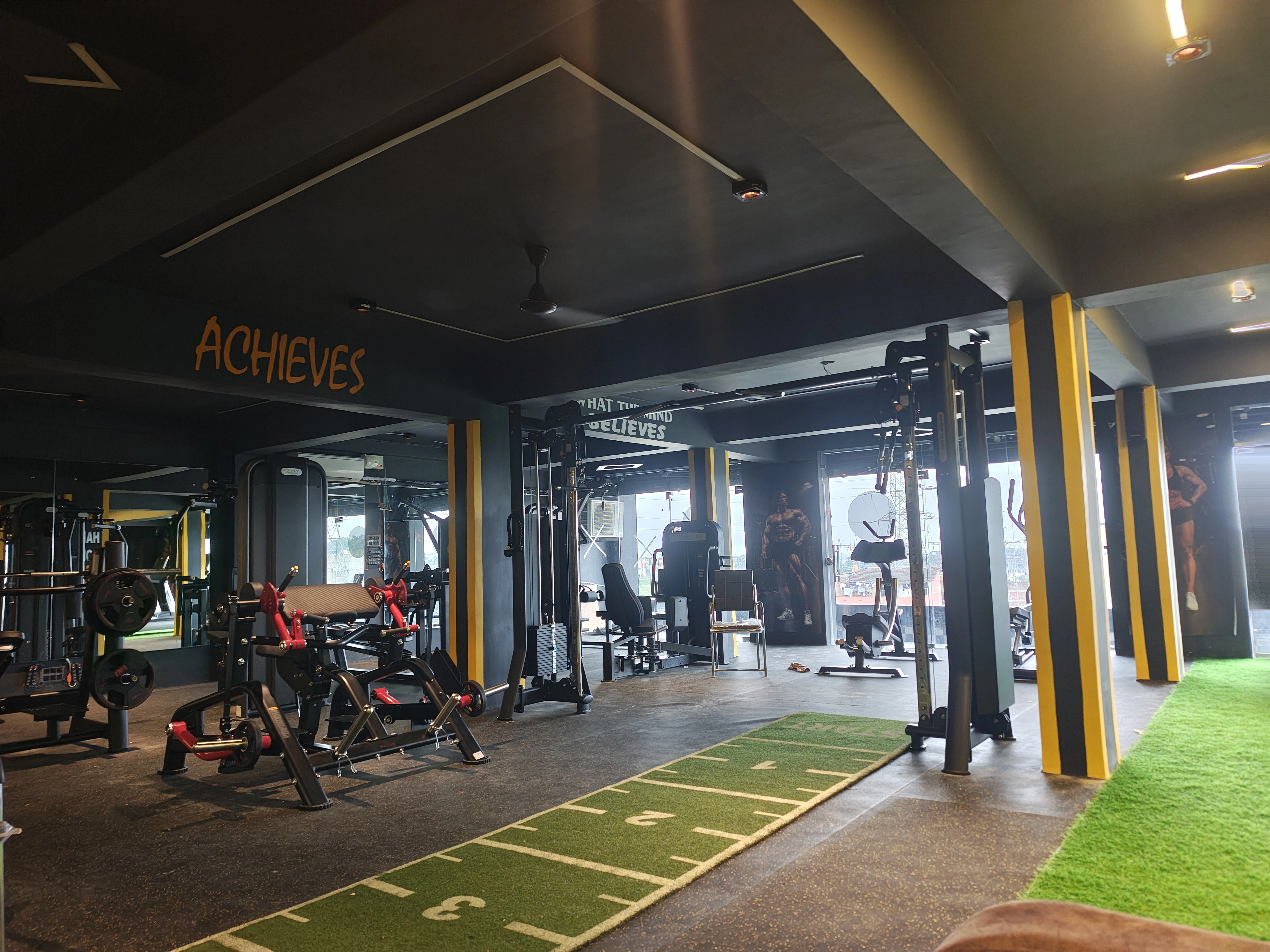 Functional training mats alongside cardio equipment